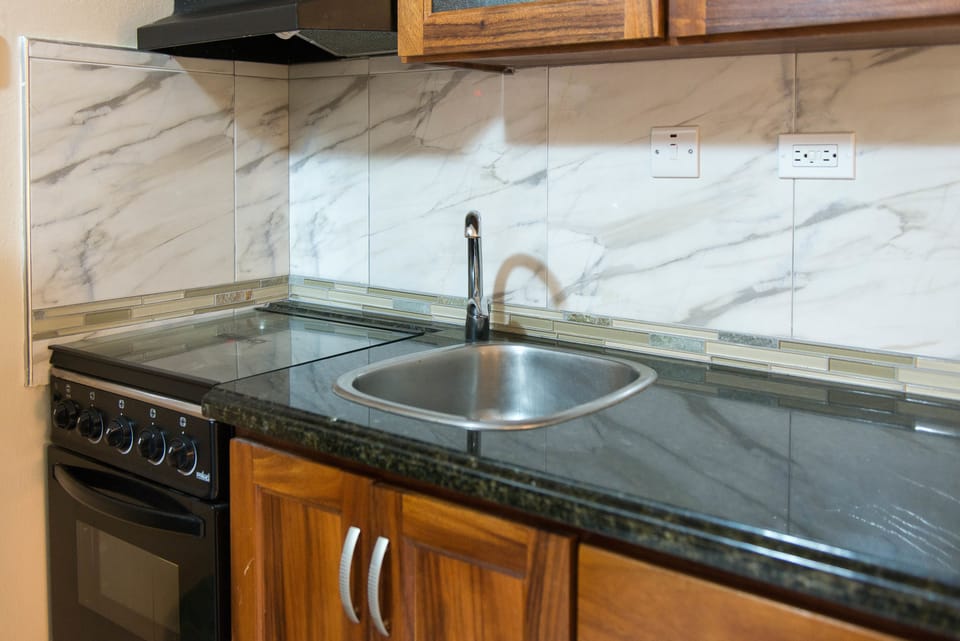 Deluxe Studio, 1 King Bed, Beachside | Private kitchen | Coffee/tea maker, fridge, microwave, stovetop