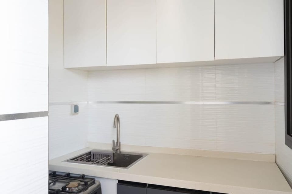 Mini-fridge, oven, stovetop, cookware/dishes/utensils