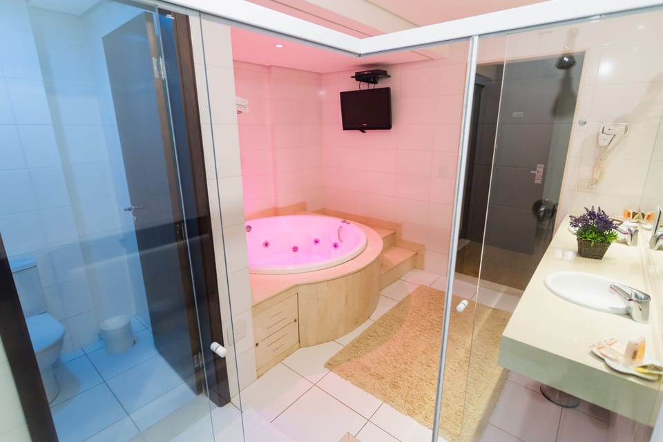 Premium Suite, 1 King Bed | Bathroom | Free toiletries, hair dryer, towels, soap