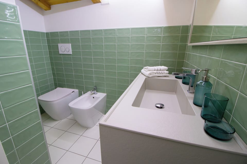 Deluxe Triple Room, Balcony, Mountain View | Bathroom | Hair dryer, towels, soap, shampoo