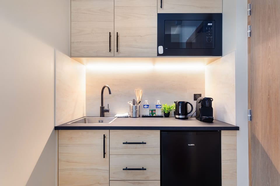 Mini-fridge, microwave, cookware/dishes/utensils