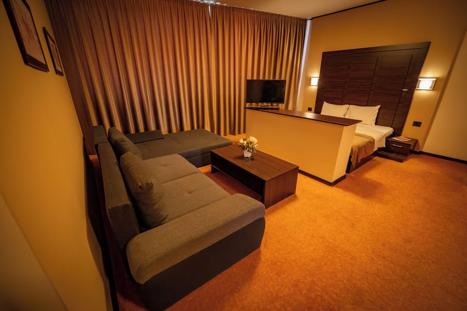 Apartment, Non Smoking | Minibar, desk, blackout drapes, iron/ironing board