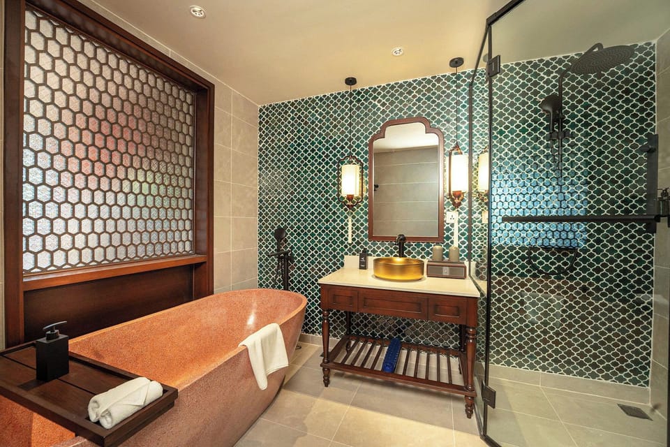 Separate tub and shower, rainfall showerhead, hair dryer, bathrobes