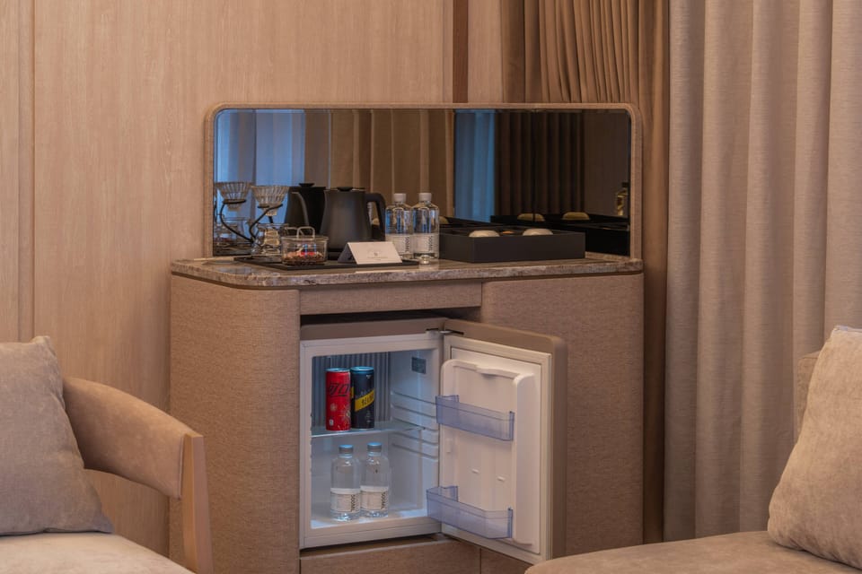 Family Room, City View | Down comforters, minibar (free items), laptop workspace, blackout drapes