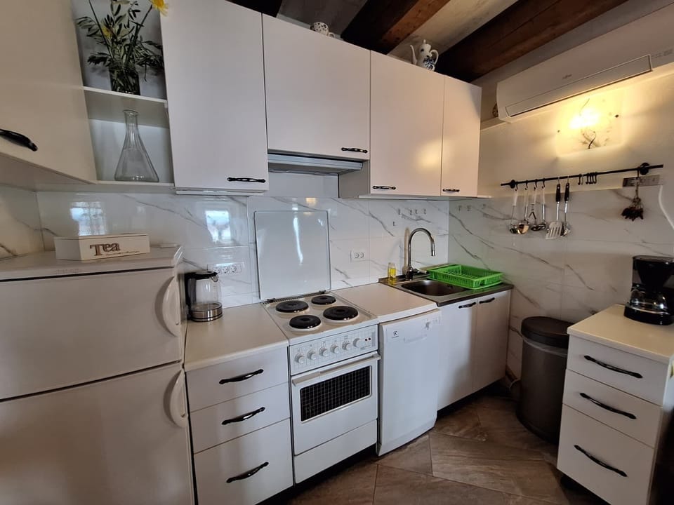 Apartment (A1) | Private kitchen | Espresso maker, fridge, microwave, stovetop