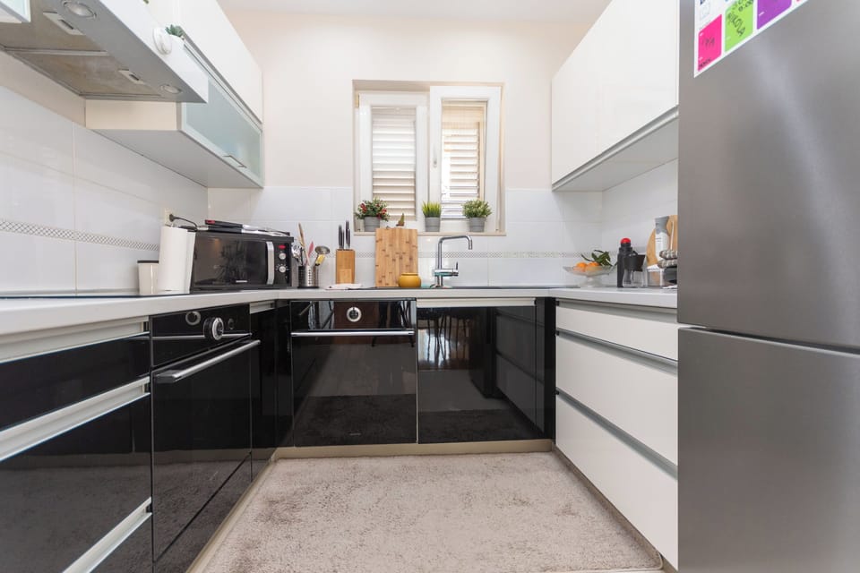 Villa | Private kitchen | Fridge, oven, stovetop, dishwasher