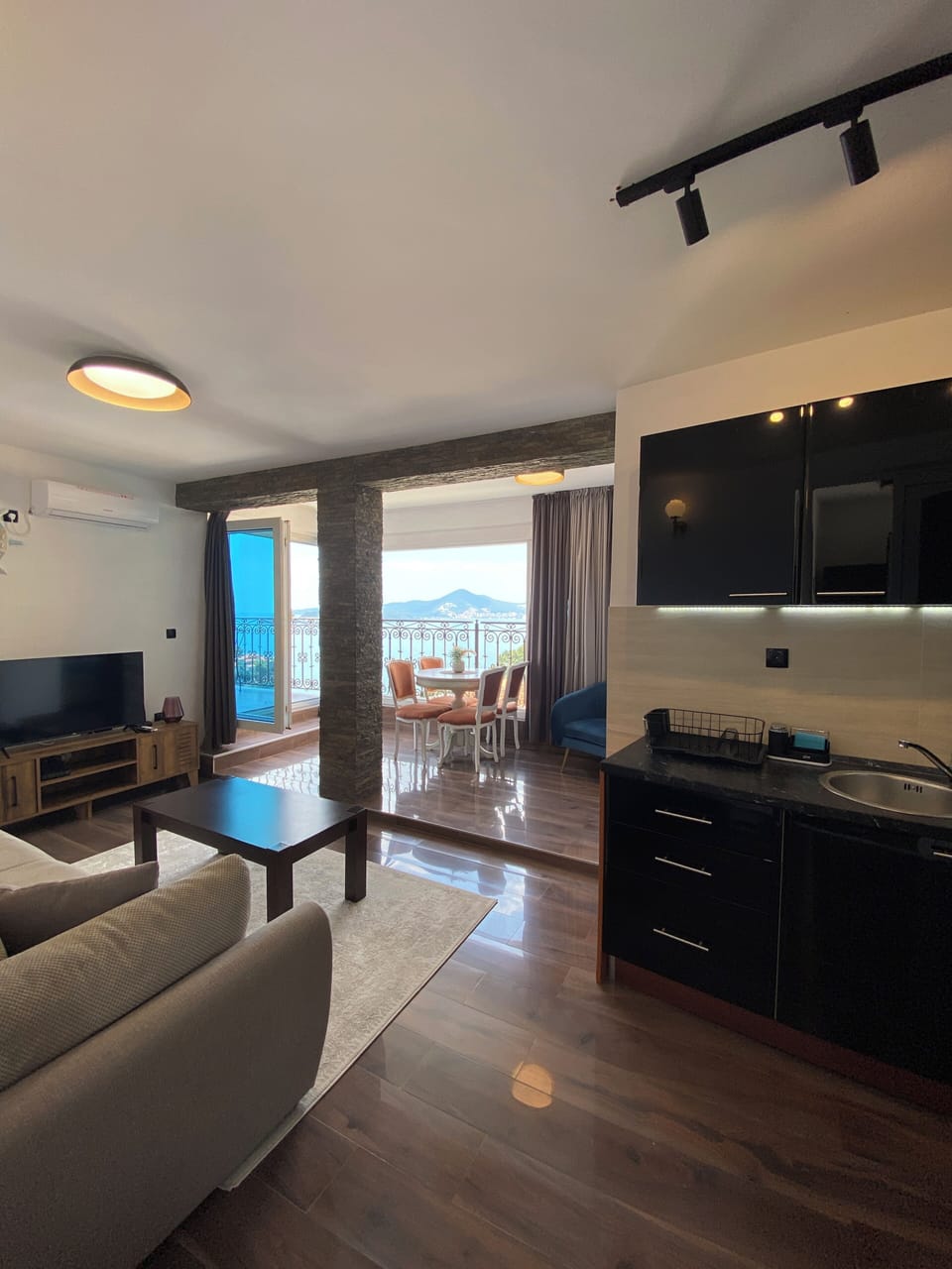Apartment, Sea View | Living area | Flat-screen TV