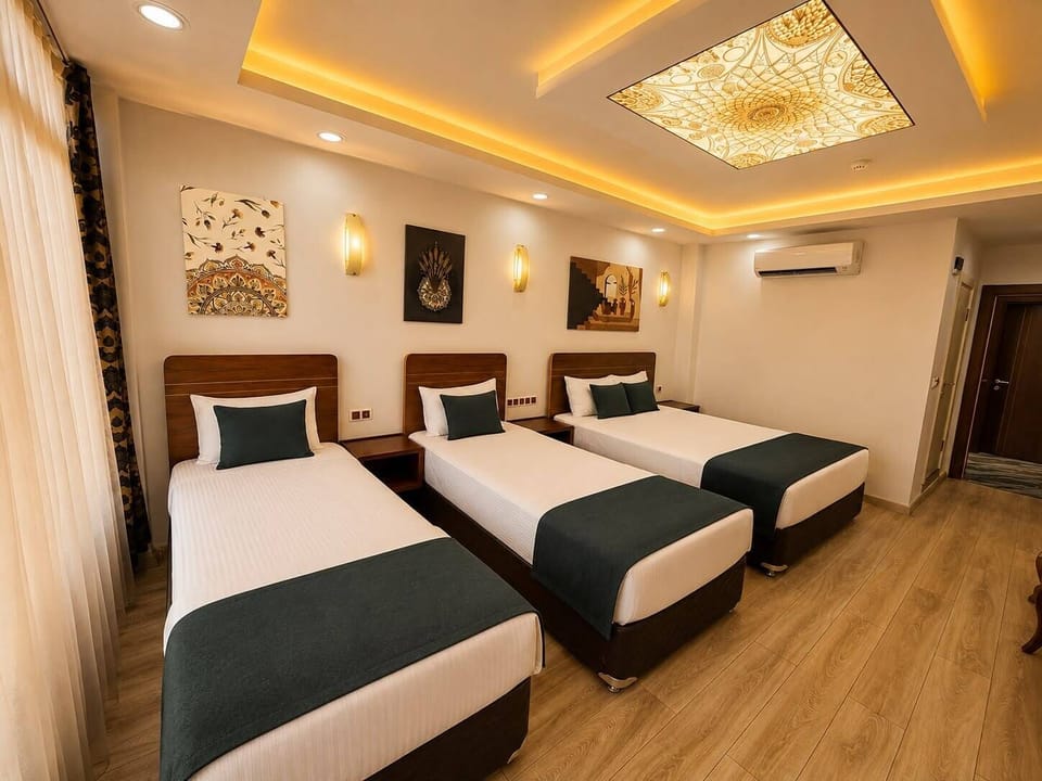 Family Quadruple Room, City View | WiFi (free), bed sheets