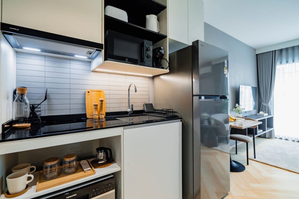 Classic Studio, Balcony, Pool View | Private kitchen | Coffee/tea maker, electric kettle, highchair
