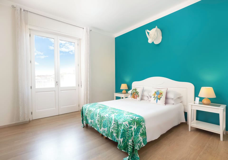 Family Triple Room, Balcony, City View | Desk, iron/ironing board, free WiFi