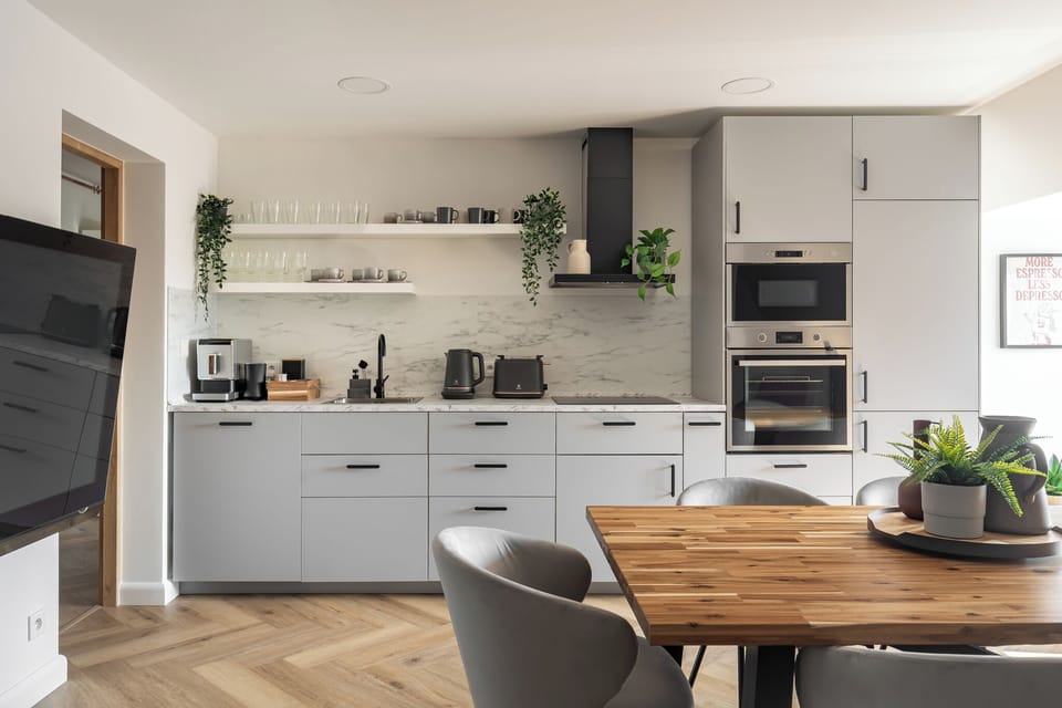 Deluxe Apartment, City View, Beachside | Private kitchen | Coffee/tea maker, electric kettle, toaster, highchair