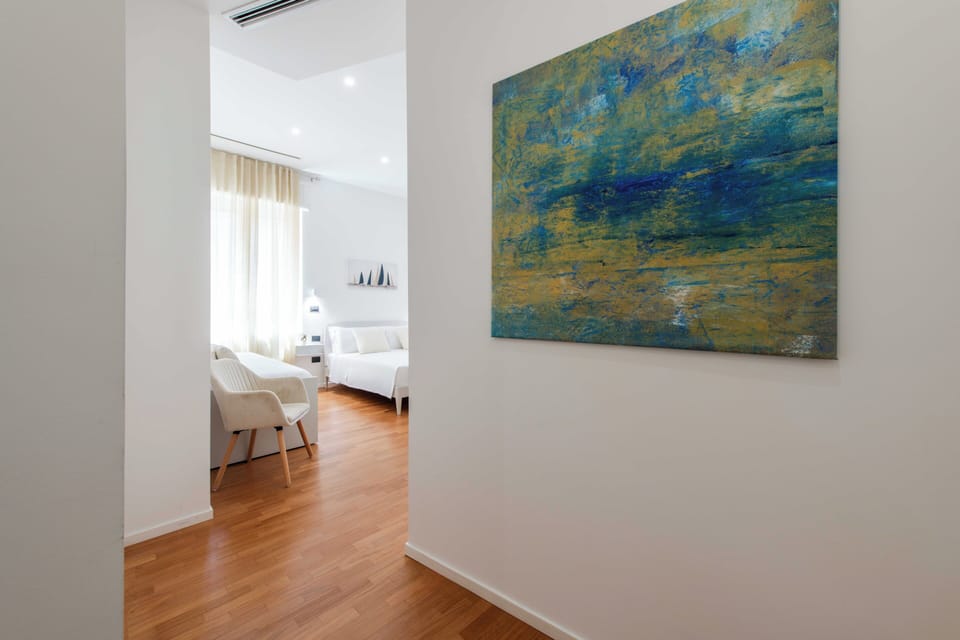 Luxury Triple Room, City View | Memory foam beds, minibar, desk, laptop workspace