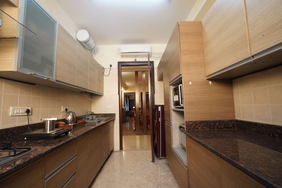 Apartment | Private kitchen | Full-size fridge, coffee/tea maker
