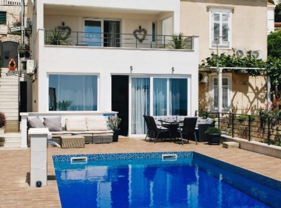 Apartment (Two Bedroom Apartment with Sea View) | Outdoor pool | Seasonal outdoor pool, pool umbrellas, sun loungers