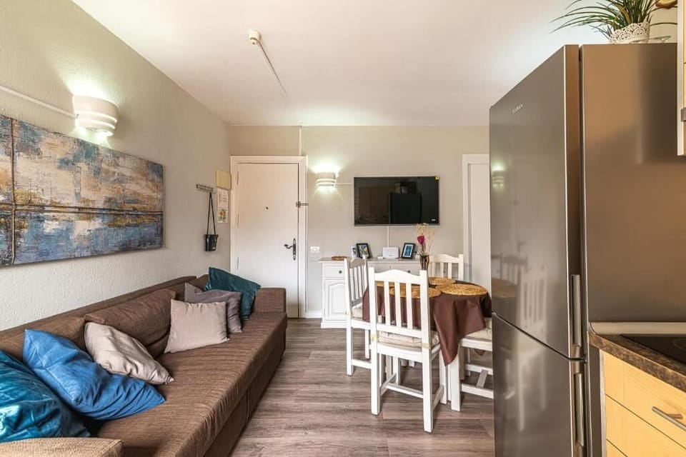 Deluxe Apartment, Balcony, City View | Living area | 32-inch flat-screen TV with cable channels