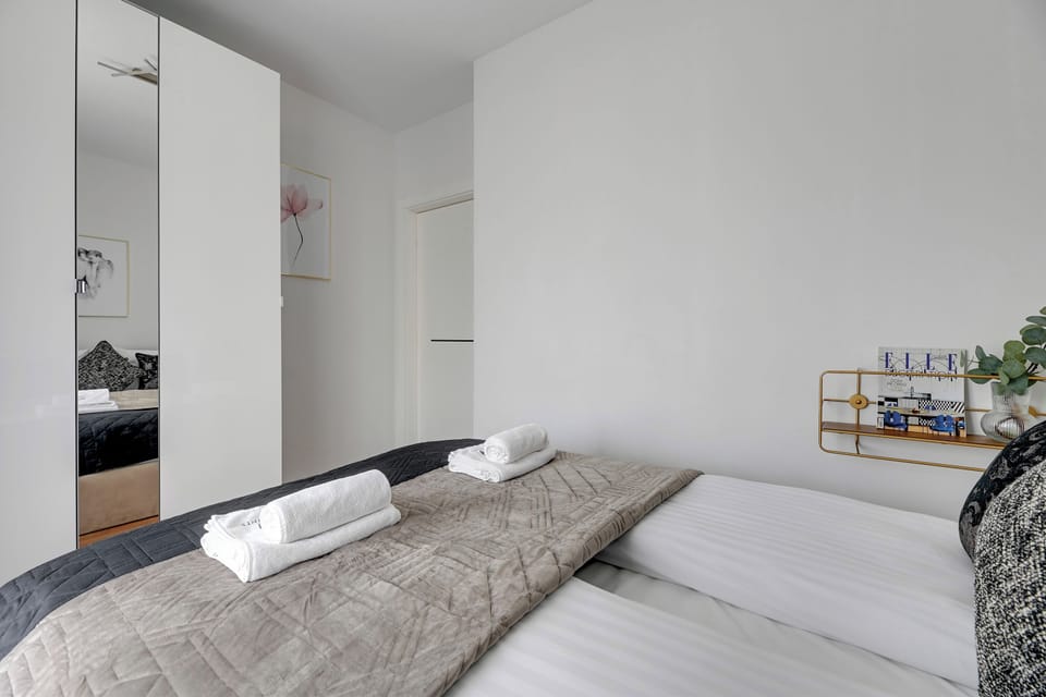 Deluxe Apartment, Balcony, Courtyard View | Iron/ironing board, WiFi (free), individually furnished, bed sheets