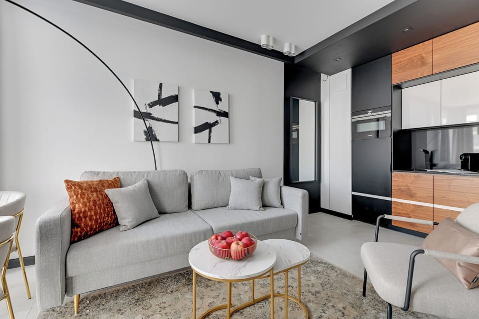 Deluxe Apartment, Balcony, Courtyard View | Living area | 40-inch flat-screen TV with cable channels