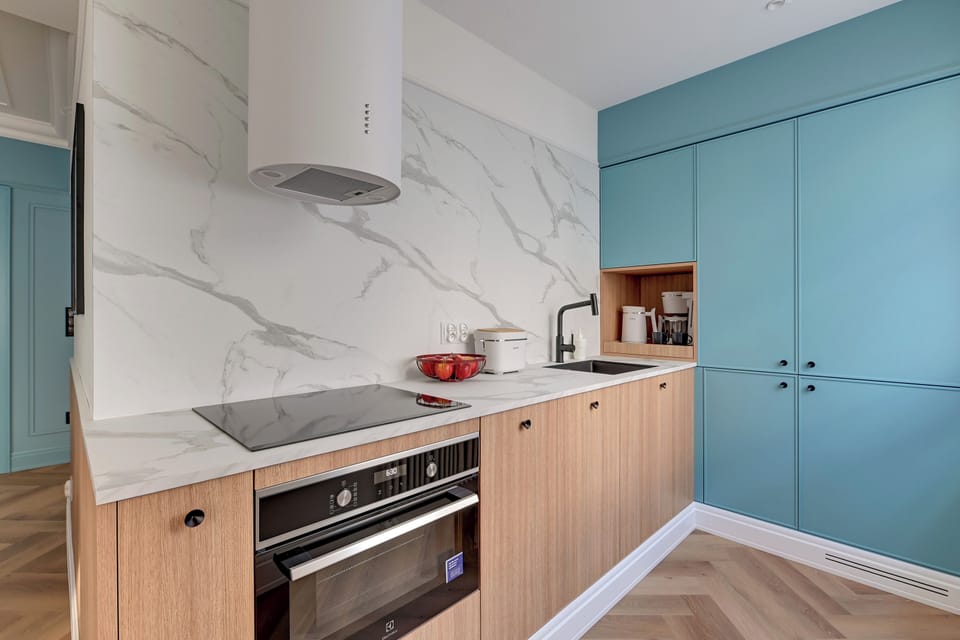 Deluxe Apartment, Balcony, Courtyard View | Private kitchen | Coffee/tea maker, electric kettle, toaster, highchair
