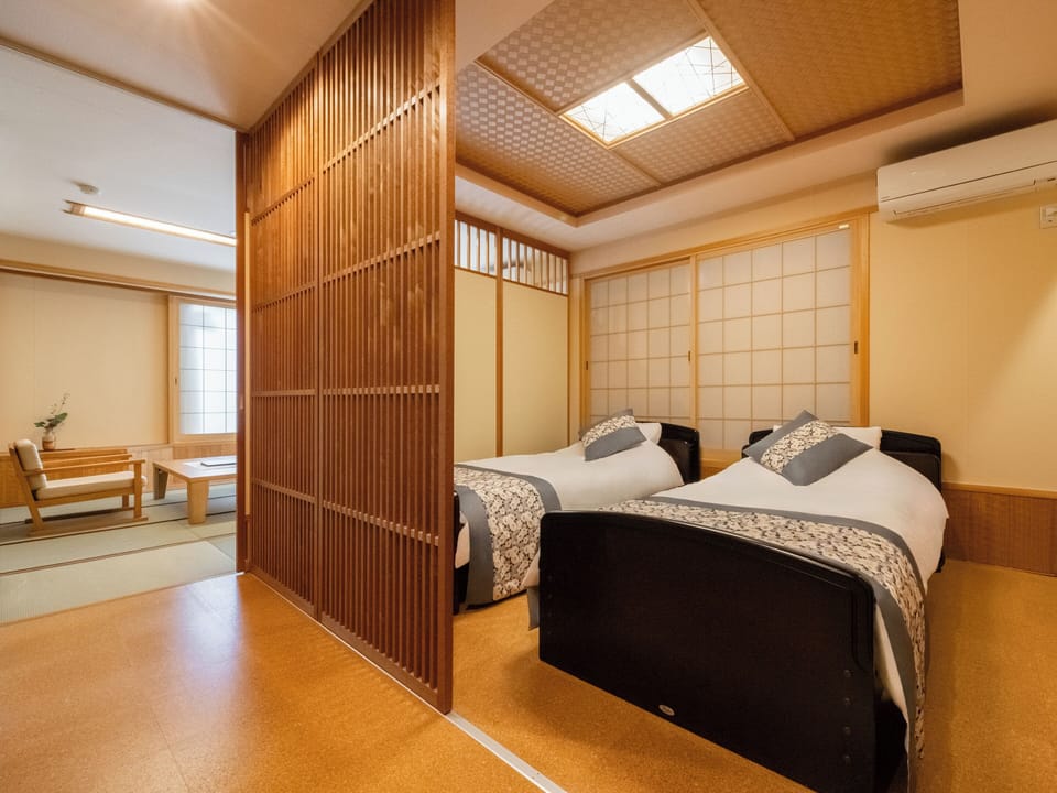 Family Room, Multiple Beds, City View | Down comforters, in-room safe, desk, WiFi (free)