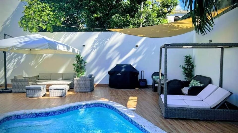 Outdoor pool, pool umbrellas, sun loungers
