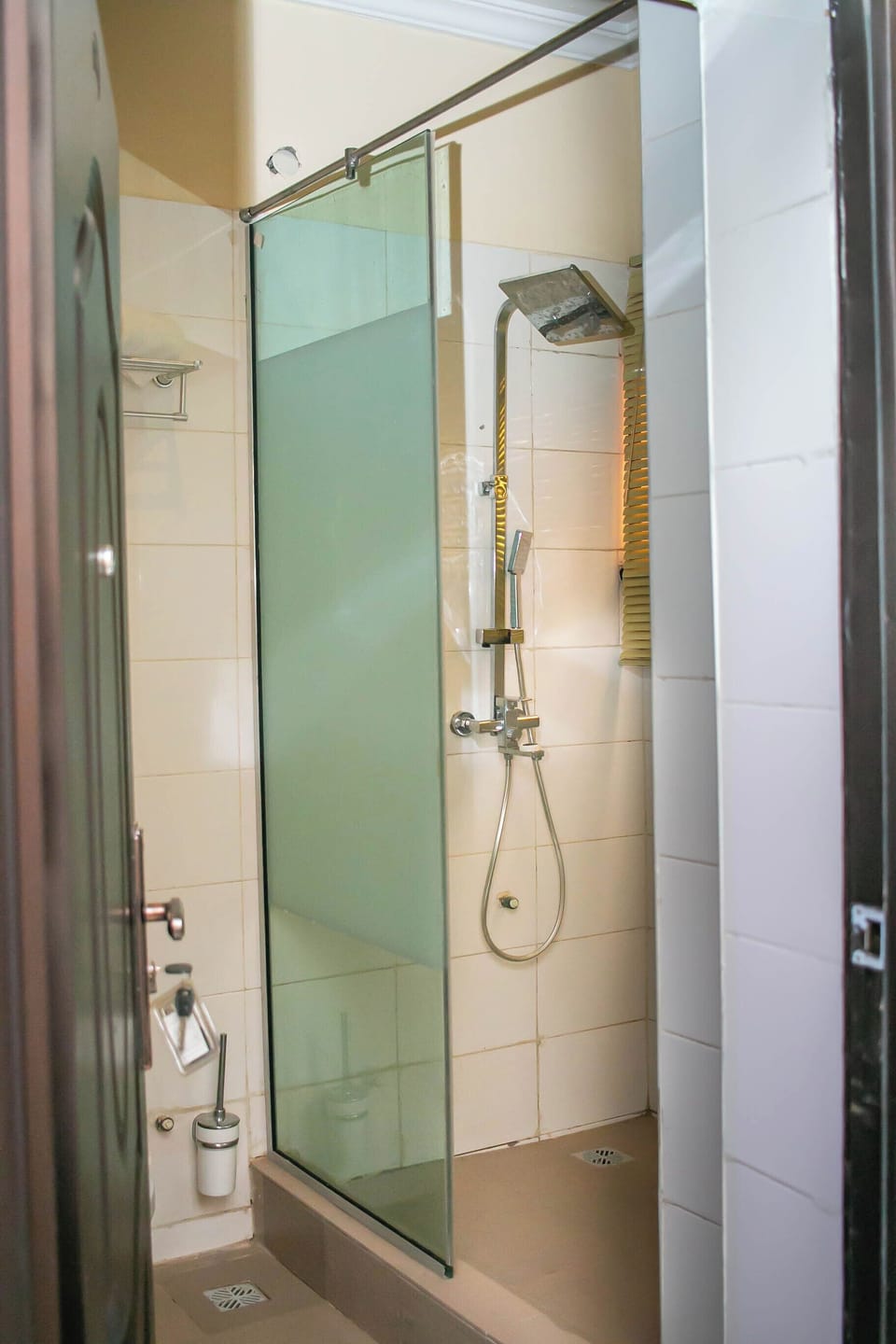 Deluxe Studio Suite | Bathroom | Shower, towels, soap, toilet paper