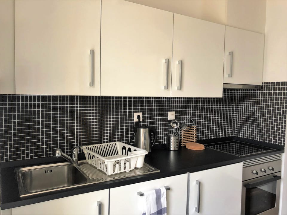 Microwave, coffee/tea maker, cookware/dishes/utensils