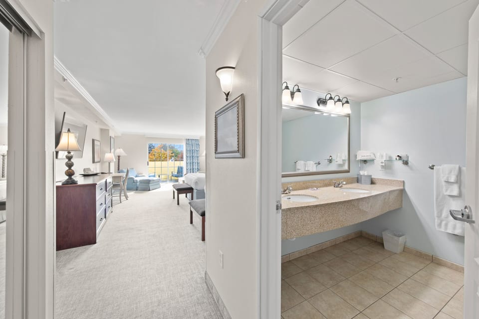 Suite Sized Double Queen Balcony Rehoboth Avenue with Tub  | Bathroom | Combined shower/tub, designer toiletries, hair dryer, bathrobes
