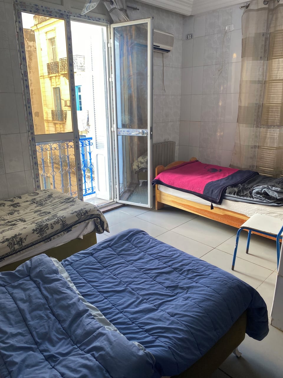Basic Triple Room, Balcony, City View | Laptop workspace, WiFi (free), bed sheets