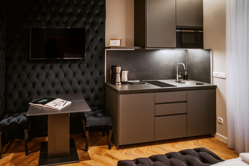 Junior Suite with Balcony | Private kitchen | Fridge, microwave, espresso maker, coffee/tea maker
