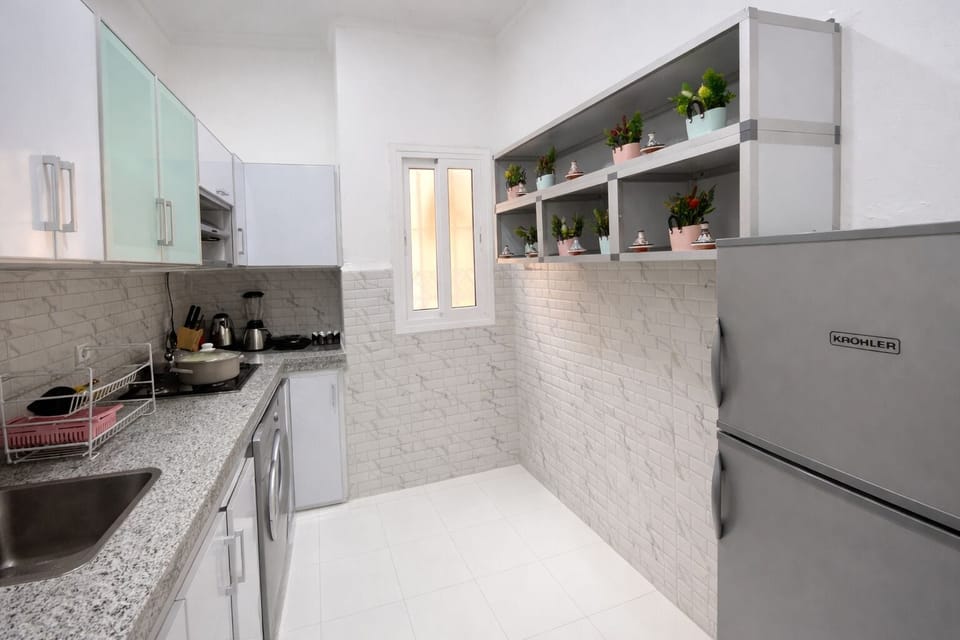 Apartment, Balcony, City View | Private kitchen | Electric kettle, toaster