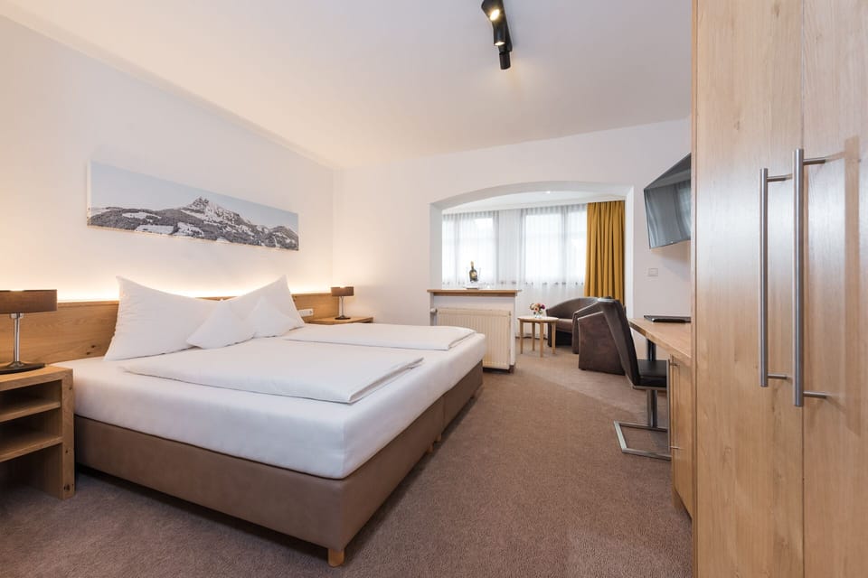 Triple Room, Balcony, Mountain View | Hypo-allergenic bedding, down comforters, in-room safe