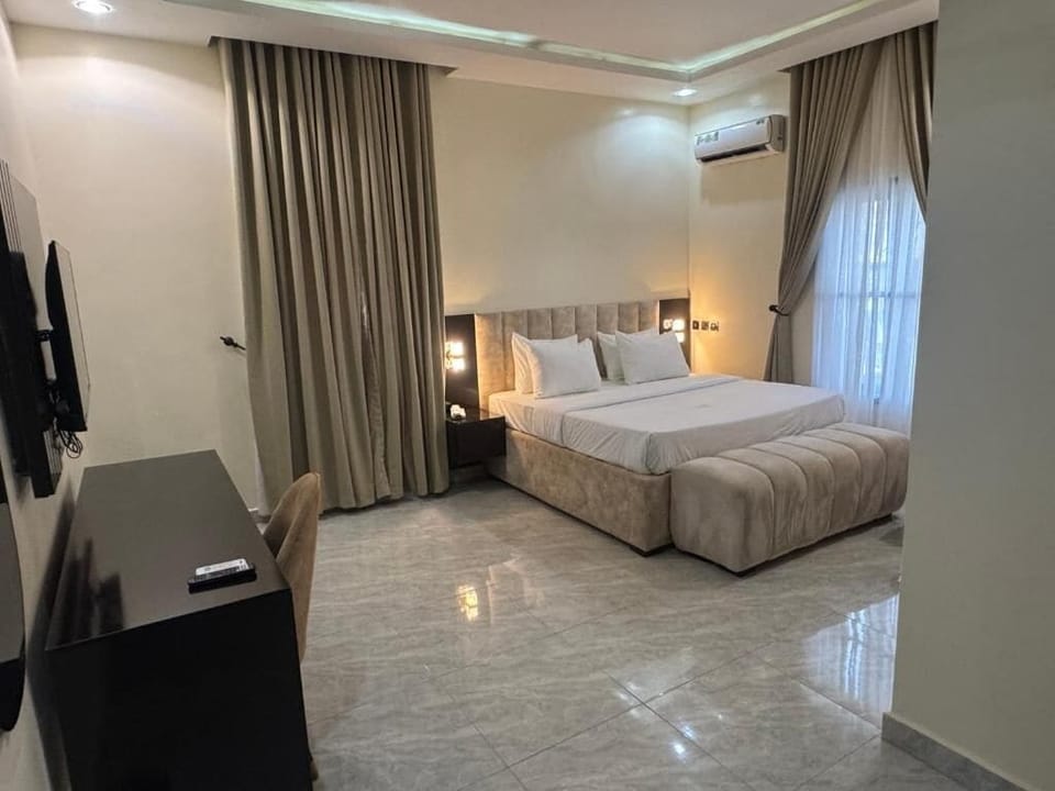 Deluxe Room, Balcony, City View | Desk, laptop workspace, blackout drapes, soundproofing