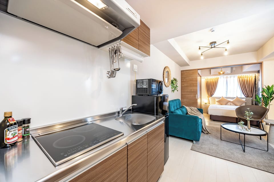 Standard Apartment, Non Smoking, Lanai | Private kitchen | Full-size fridge, microwave, stovetop, cookware/dishes/utensils