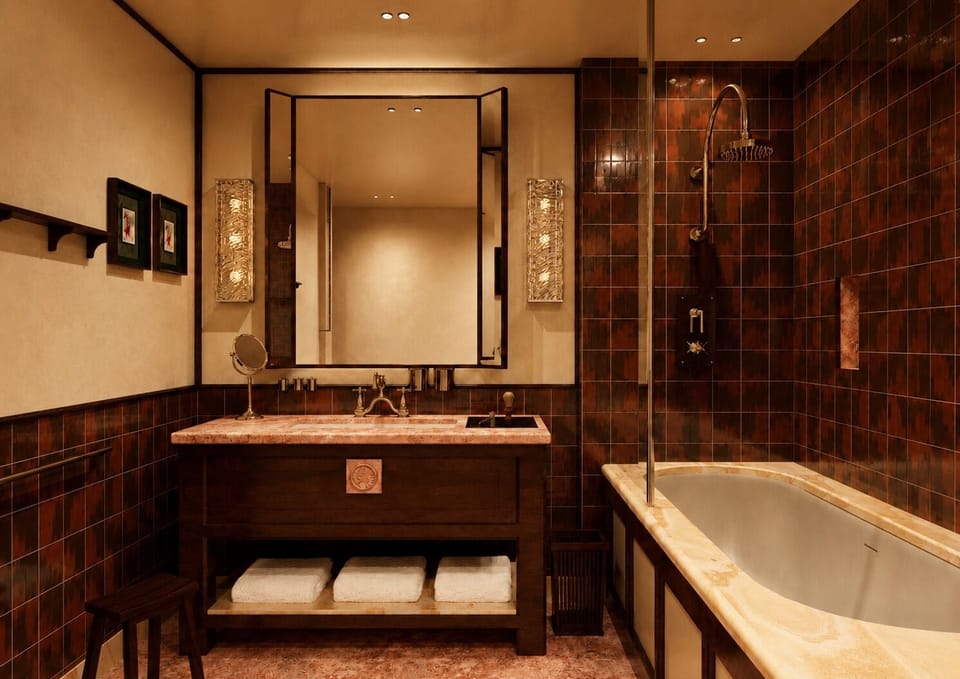 Suite Bourbon | Bathroom | Hair dryer, slippers, towels, soap