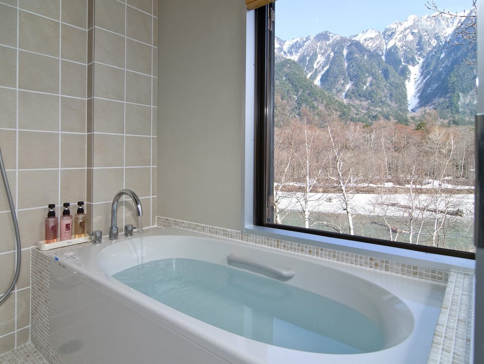 Twin Room, Private Bathroom, Non Smoking, River View | Bathroom | Spring water tub, free toiletries, hair dryer, slippers