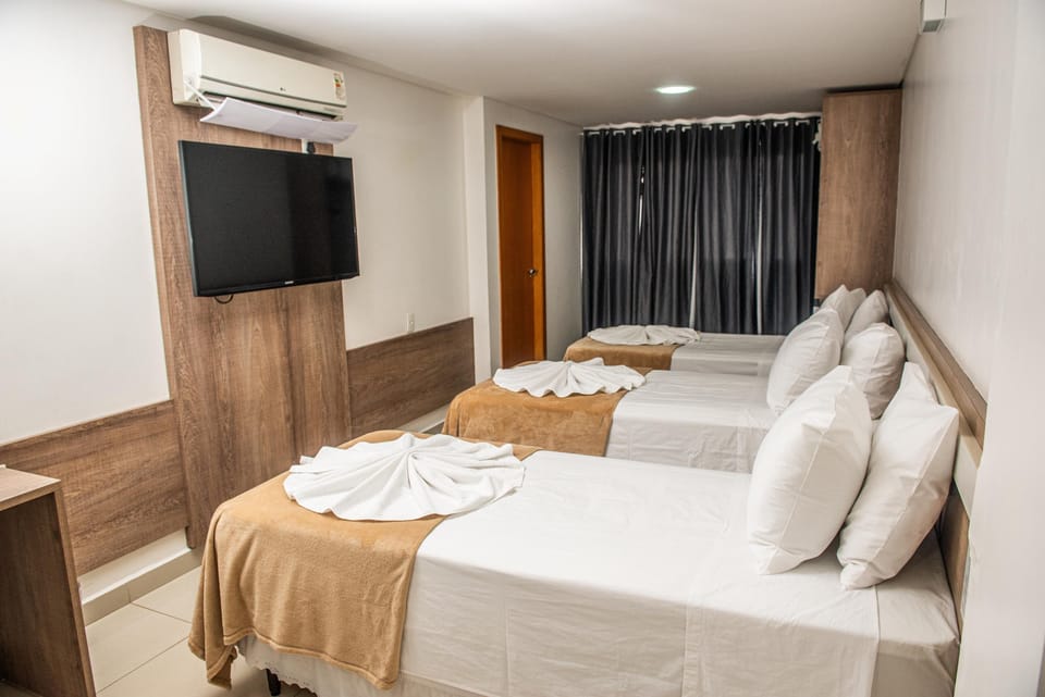 Deluxe Triple Room | Minibar, individually furnished, desk, laptop workspace