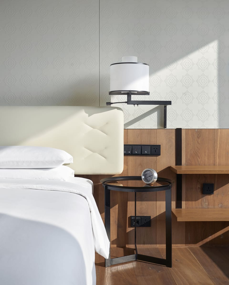 Premium bedding, down comforters, memory foam beds, minibar (free items)