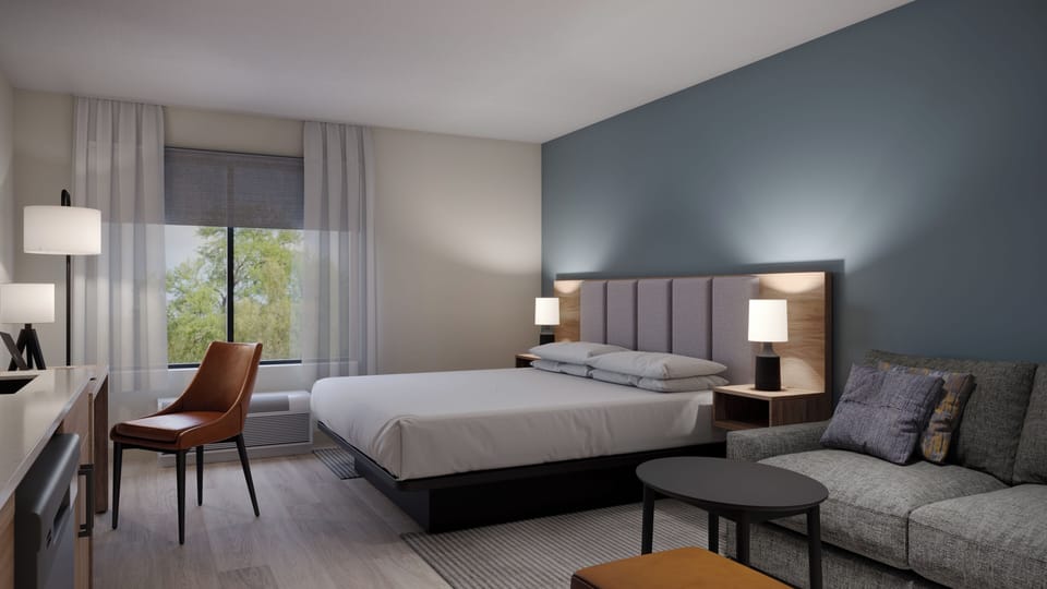 Suite, 1 King Bed with Sofa bed (1 Bedroom) | Desk, laptop workspace, blackout drapes, iron/ironing board