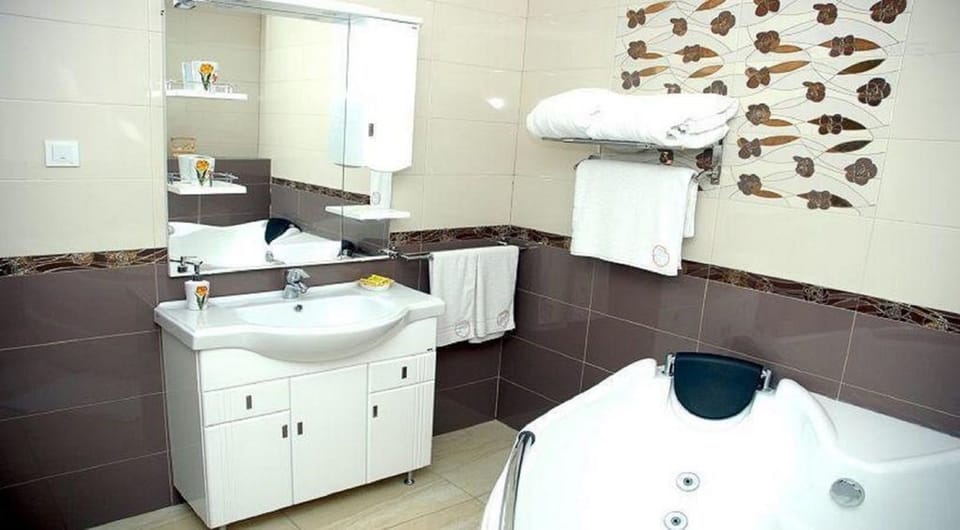 Deluxe Room | Bathroom | Bathtub, deep soaking tub, free toiletries, hair dryer (on request)