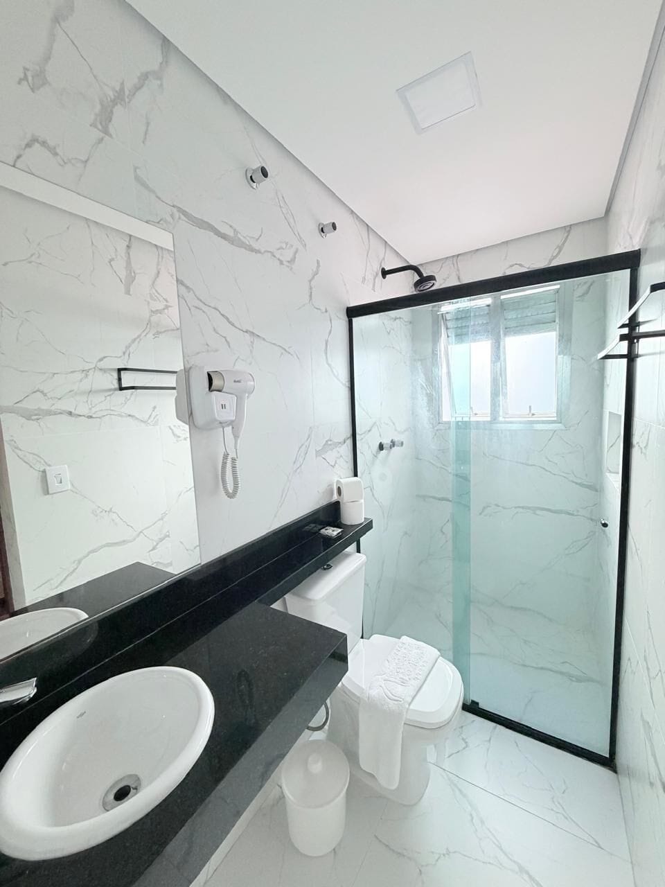Shower, hair dryer, towels