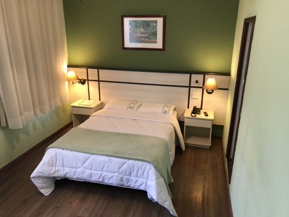 Standard Double Room | Minibar, desk, blackout drapes, iron/ironing board