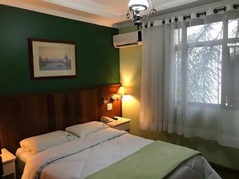 Standard Double Room | Minibar, desk, blackout drapes, iron/ironing board