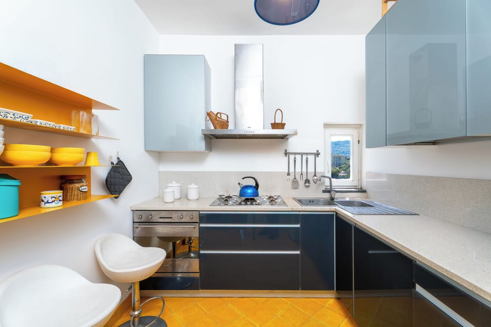 Penthouse, Sea View | Private kitchen | Espresso maker, coffee/tea maker, full-size fridge, microwave