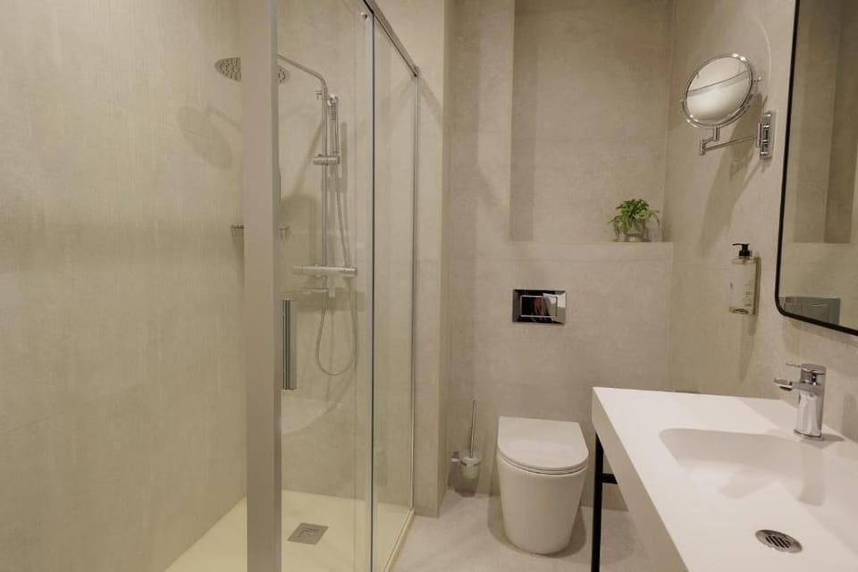 Deluxe Double Room, Balcony, Partial Sea View | Bathroom | Shower, free toiletries, hair dryer, towels