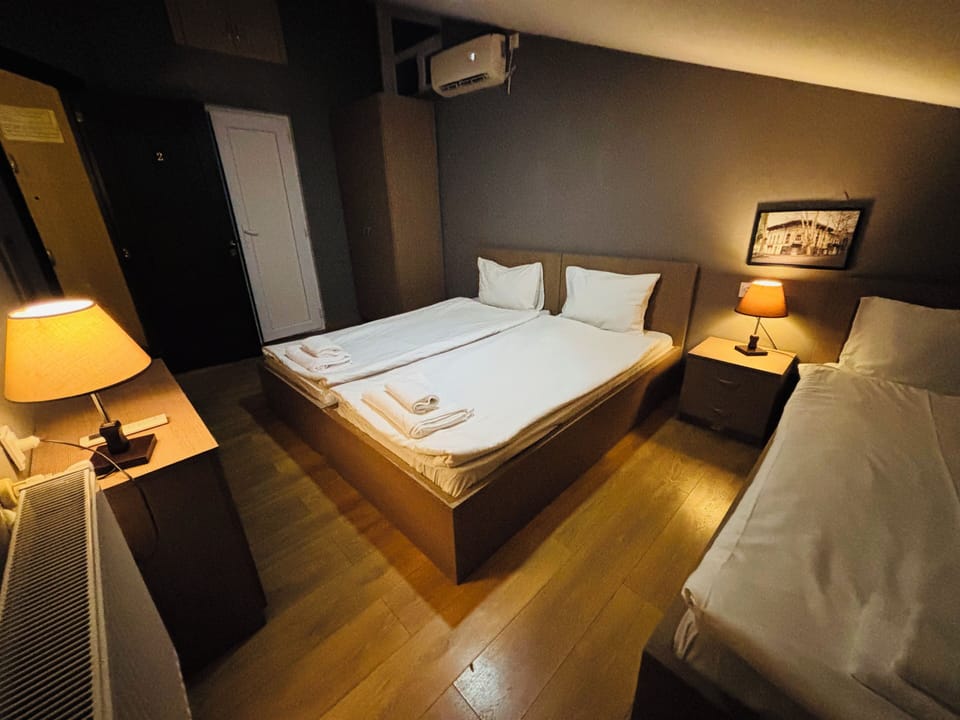 Classic Triple Room, City View | Iron/ironing board, free WiFi