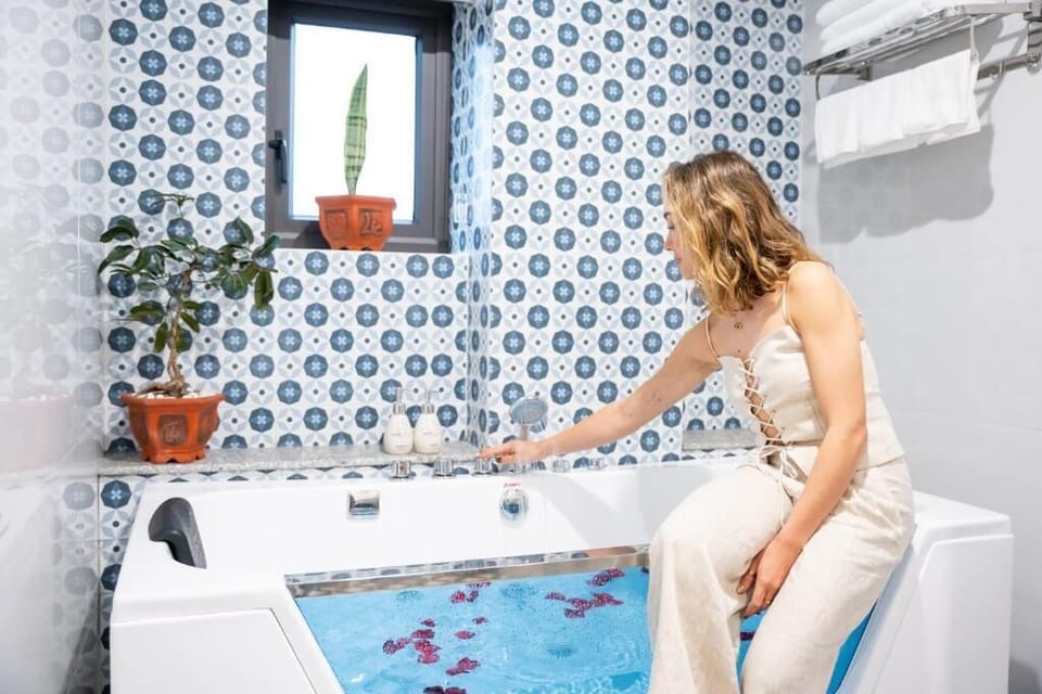 Luxury Quadruple Room, Balcony, City View | Bathroom | Shower, free toiletries, hair dryer, slippers