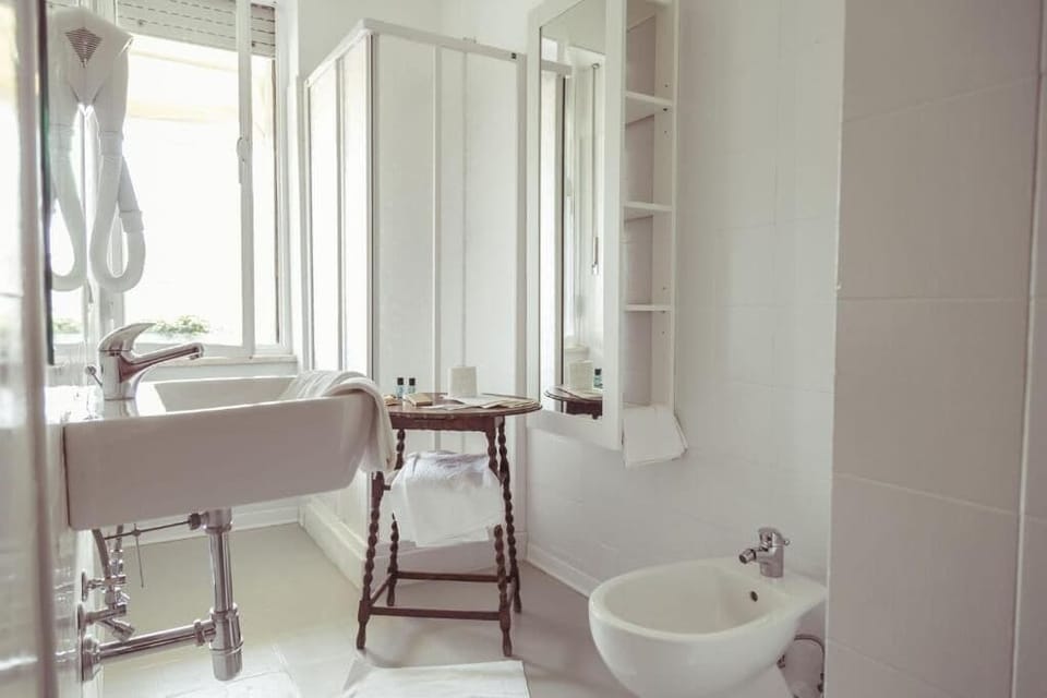 Economy Double or Twin Room | Bathroom | Free toiletries, hair dryer, towels, soap
