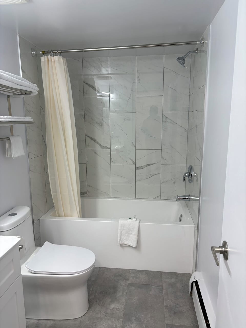 Combined shower/tub, hair dryer, towels, soap
