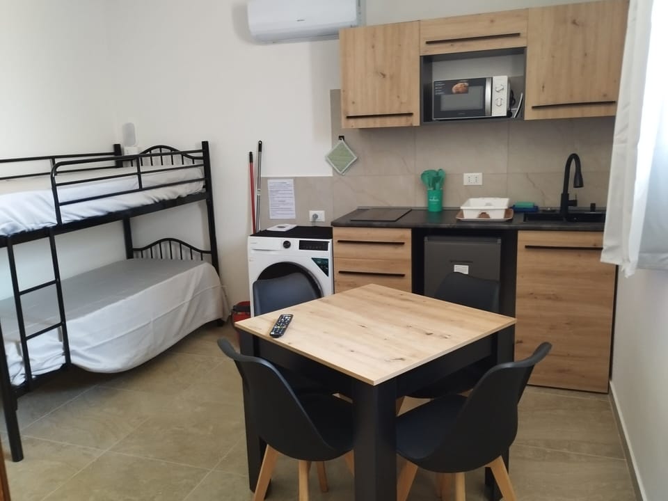 Basic Suite, Sea View | Living area | 32-inch flat-screen TV with cable channels