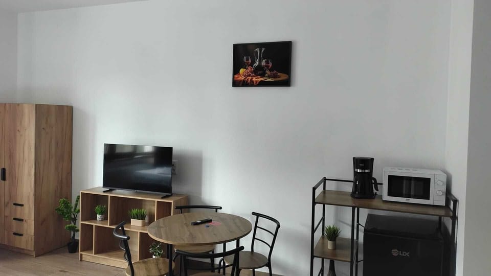 Studio, City View | Living area | Flat-screen TV
